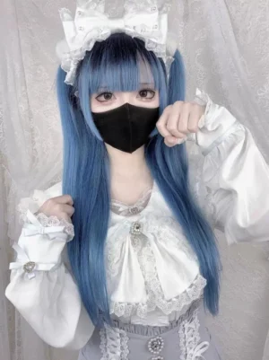 White Jirai Kei ruffled blouse with puff long sleeves and crystal decorations on model
