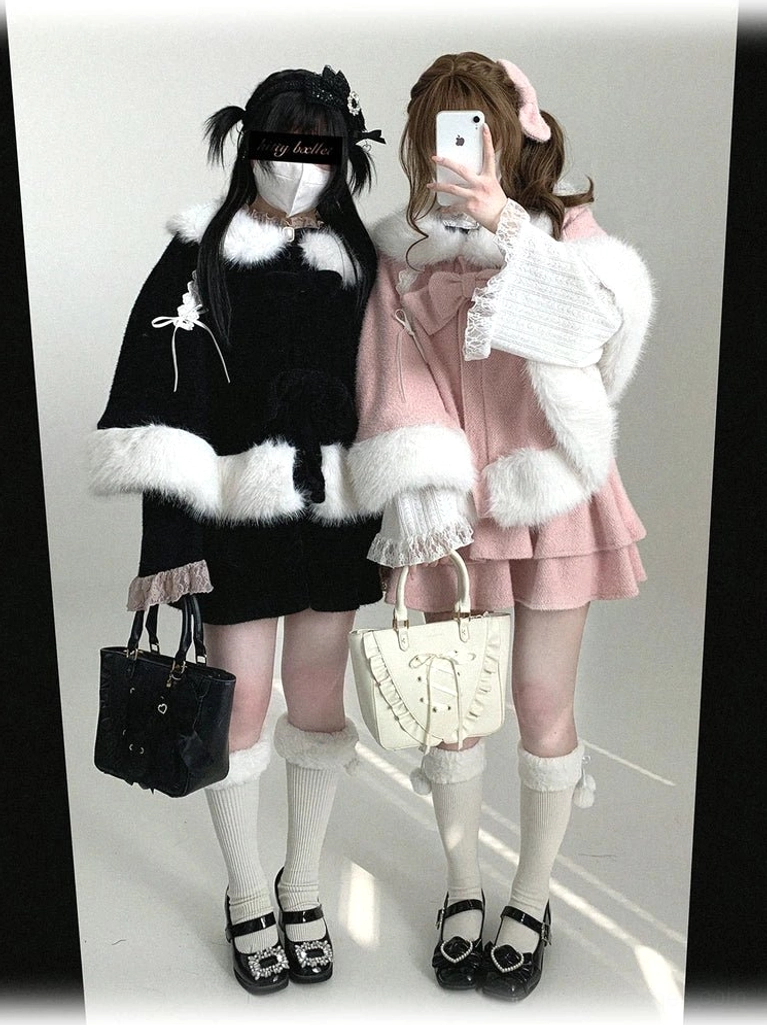 Sweet Jirai Kei bunny ear winter cape worn by model in front mirror selfie view showing black and pink colorways with fluffy white trims and removable bows