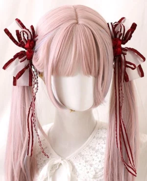 Jirai Kei butterfly bow hair clips with red rose and striped ribbon streamers worn on pink twin tails in lace Lolita outfit front view