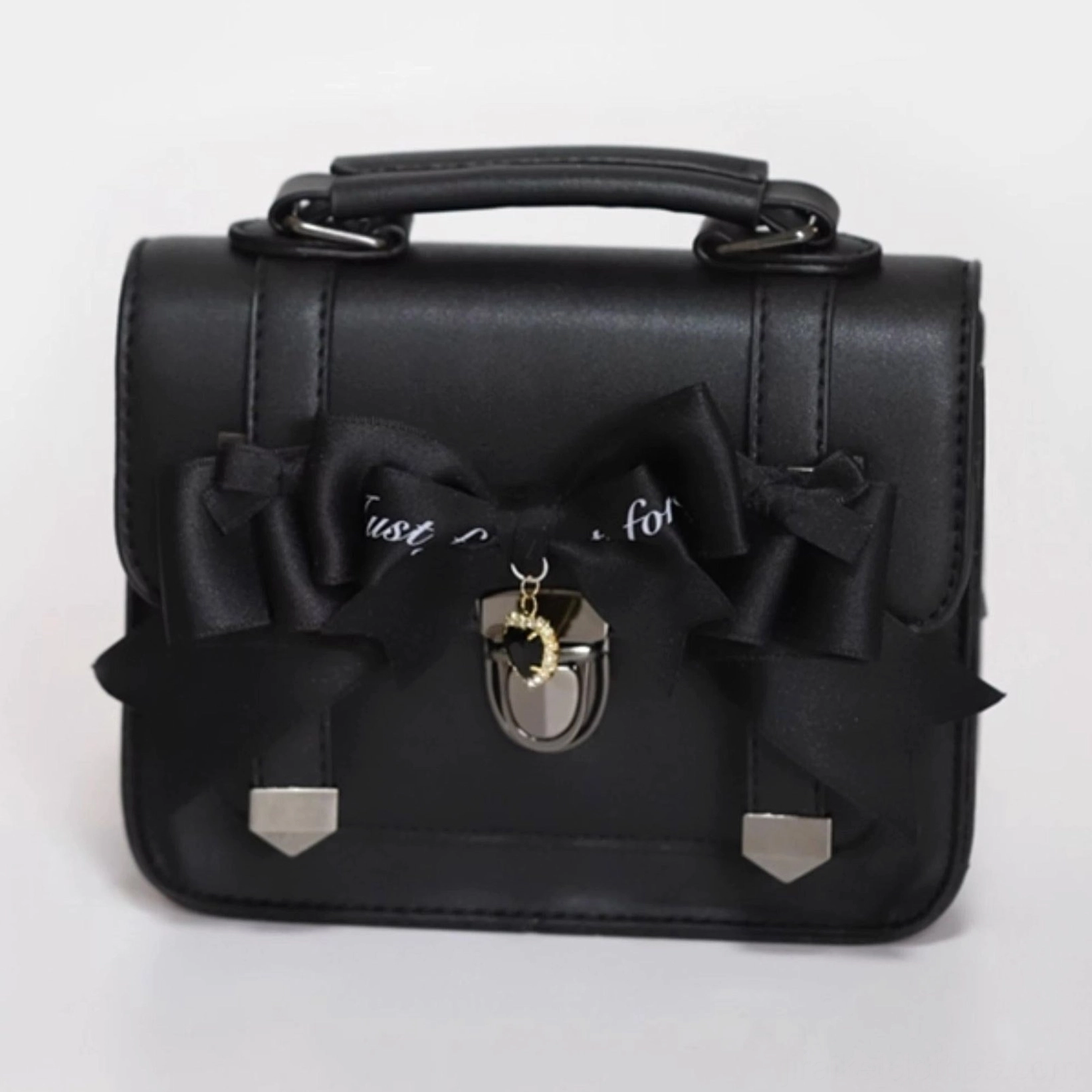 Jirai Kei Cambridge handbag shoulder strap detail showing adjustable carrying options and premium leather texture with metal hardware attachments