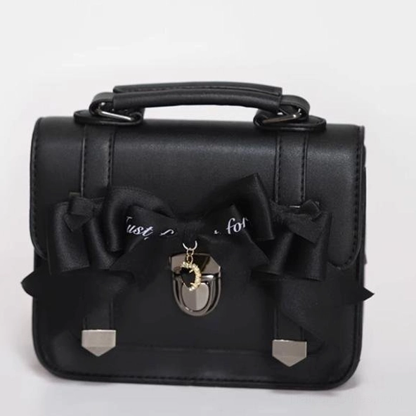 Black PU leather Jirai Kei Cambridge handbag featuring black bow with letter print detailing and hanging metal charm pendant, structured product image