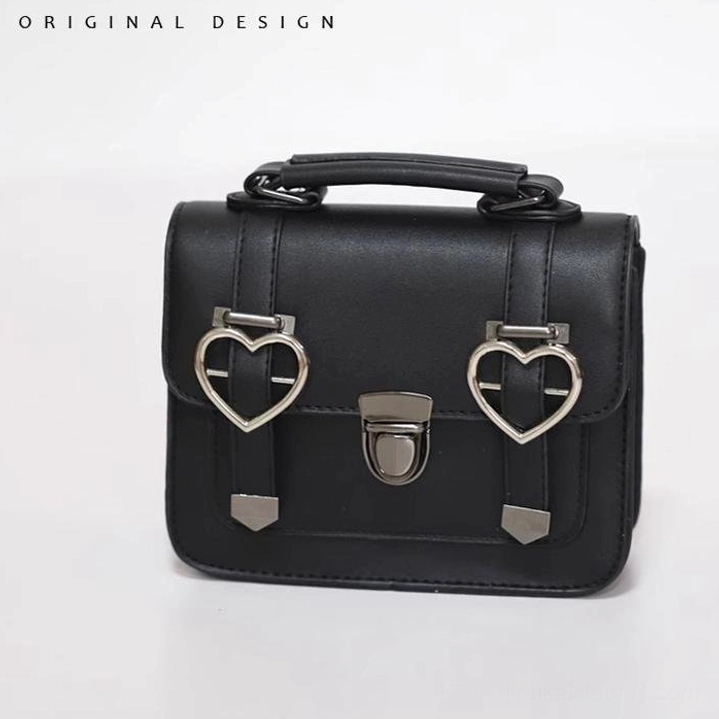 Heart-shaped metal buckle Jirai Kei Cambridge handbag with heart-shaped embellishments and central metal lock clasp on premium black PU leather