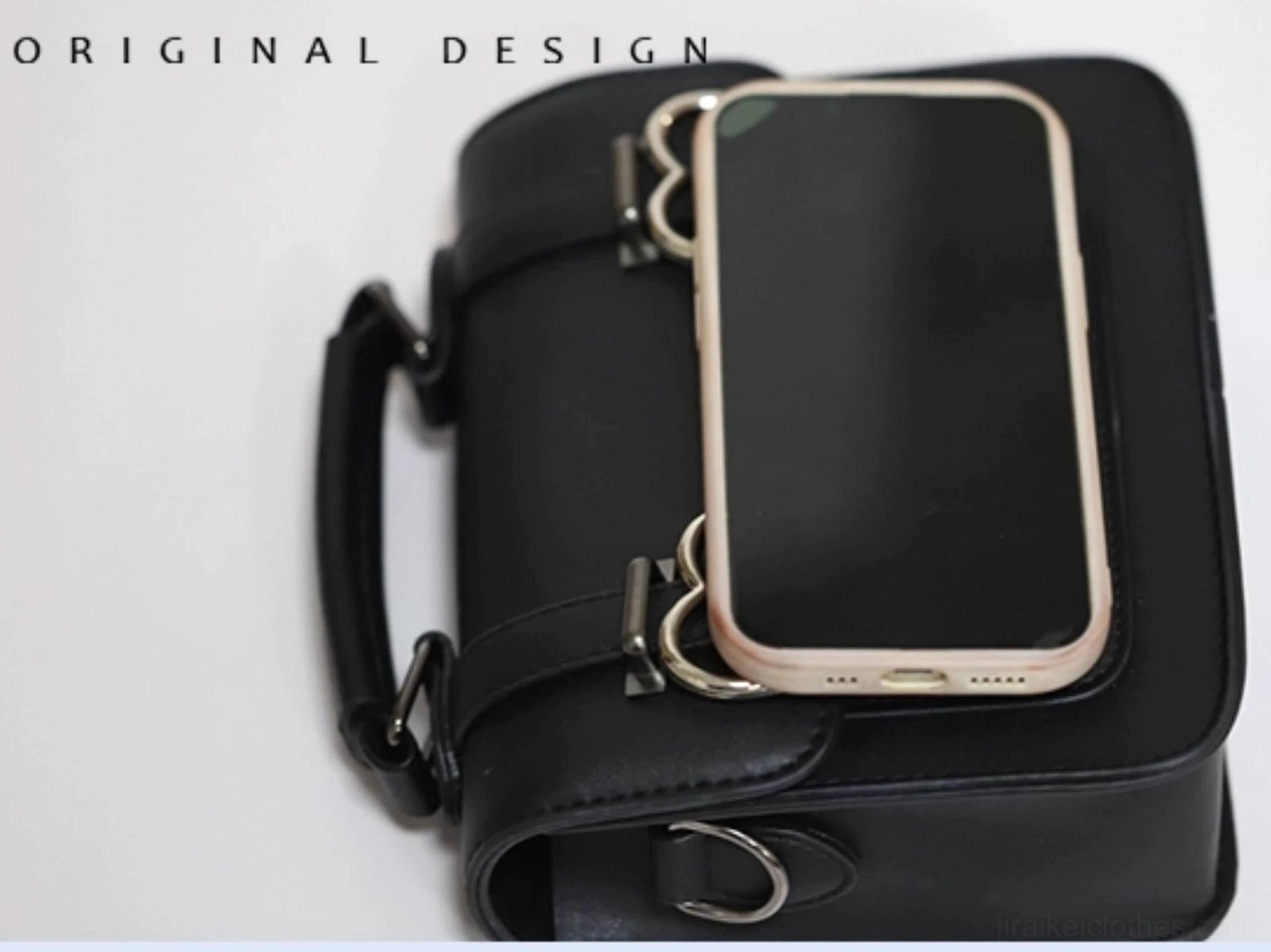 Styled lifestyle photography of black Jirai Kei Cambridge handbag with adjustable shoulder strap worn and displayed with fashion aesthetic context