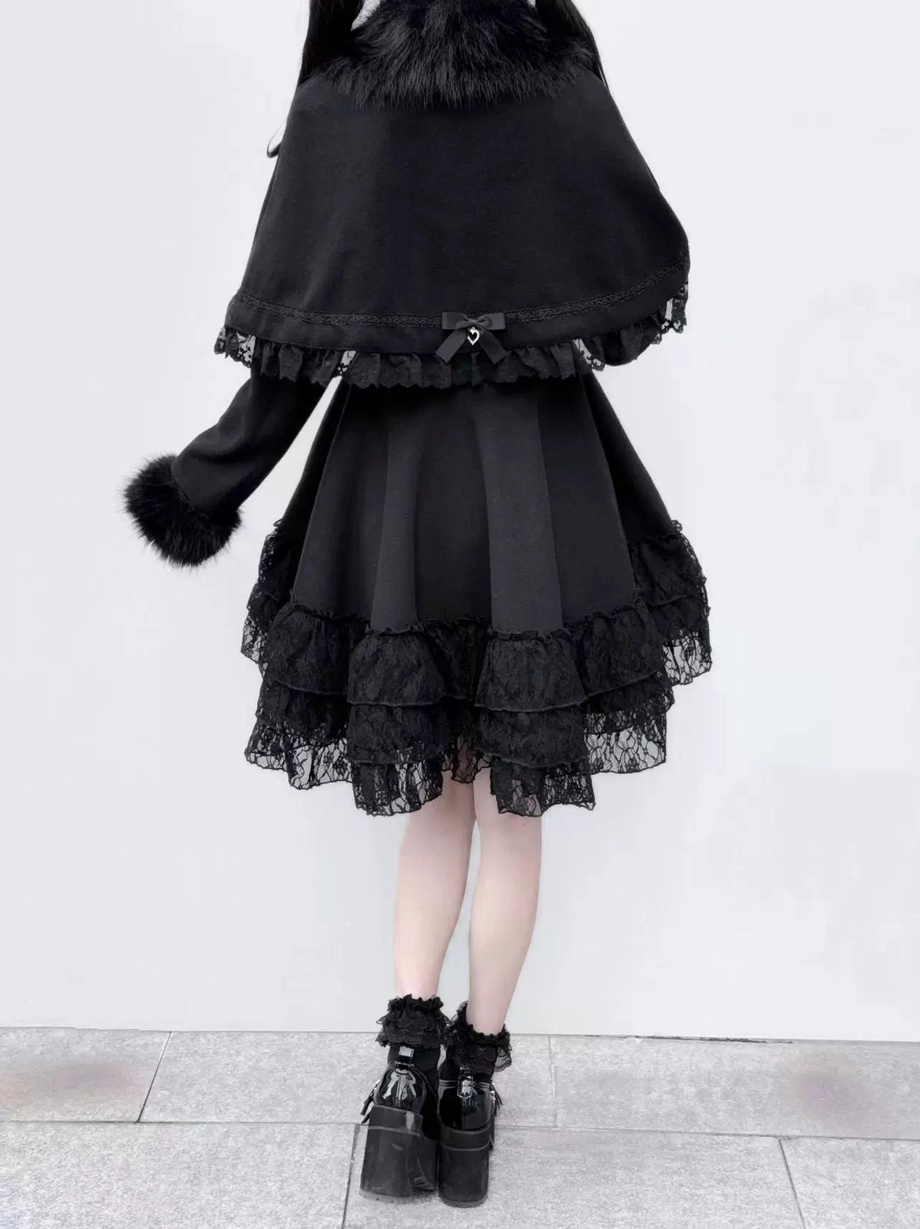 Back full body view of Jirai Kei detachable cape winter coat showing back cape design, lace ruffled hem, and single fur cuff detail