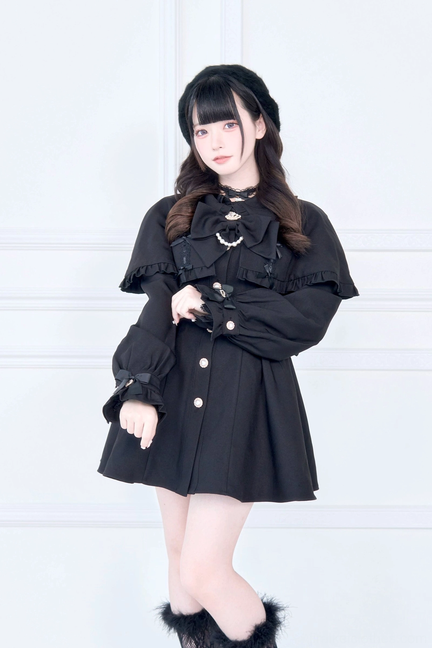 Size comparison or fit guide for Jirai Kei cape trench coat showing garment dimensions on display form