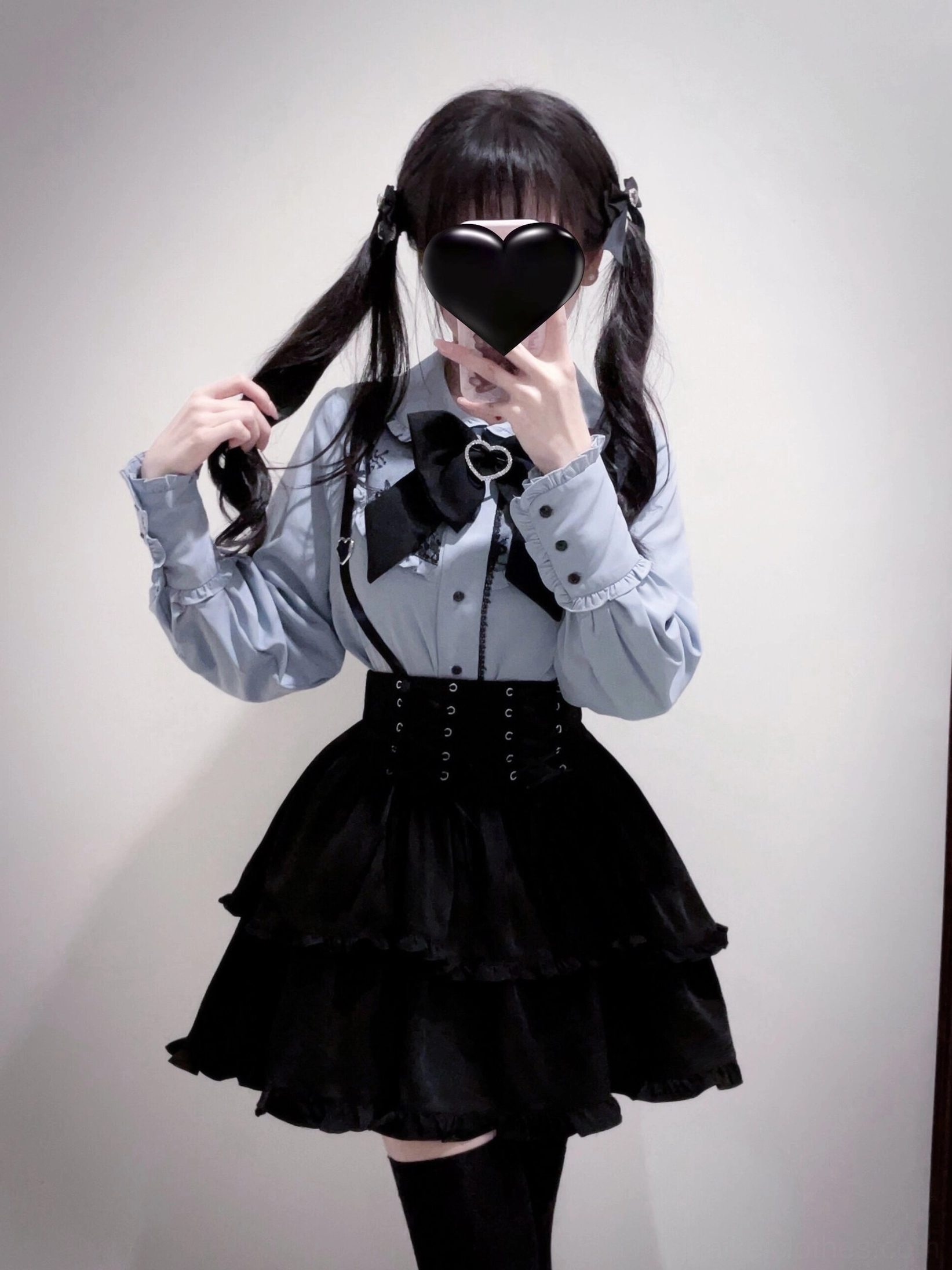 Care and maintenance guide photograph for Jirai Kei outfit showing proper washing, drying, and storage methods to preserve polyester blouse and skirt longevity