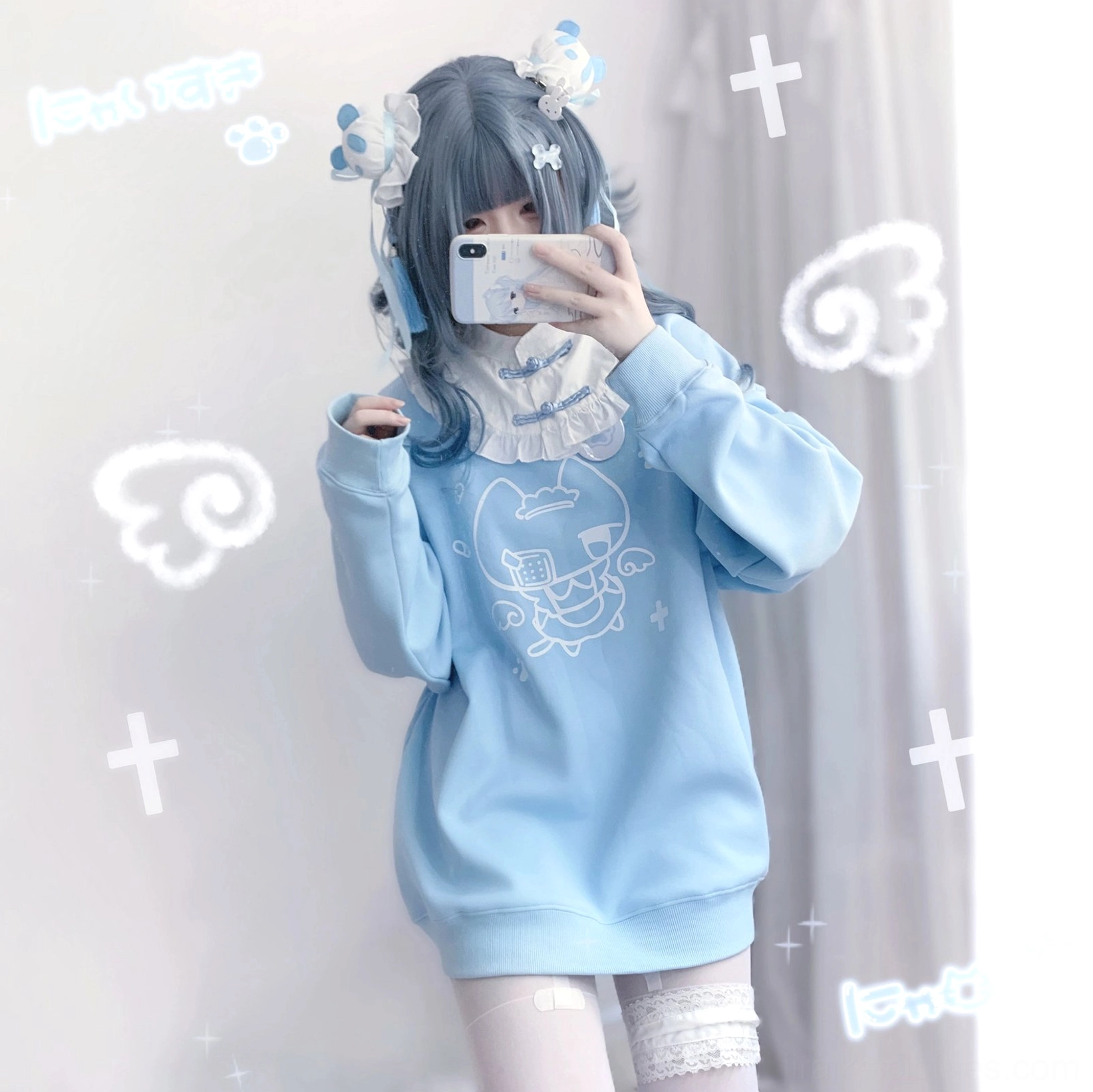 Front mirror selfie wearing light blue cat print Jirai Kei sweatshirt with lace-trimmed thigh-high stockings and loose-fitting silhouette for layered look