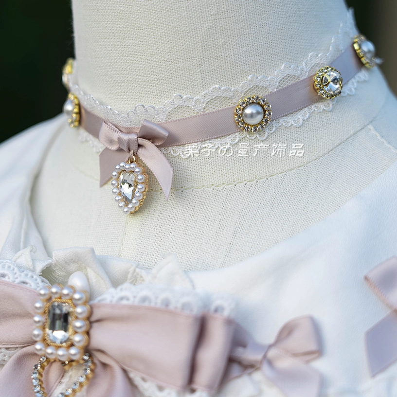 Jirai Kei choker necklace worn on dress form with lace blouse backdrop showing taupe satin band bow and rhinestone pendant