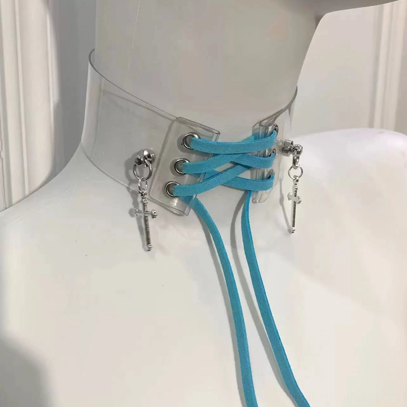 Transparent PU cross choker necklace featuring blue adjustable straps and metallic cross pendants, angled perspective on mannequin display