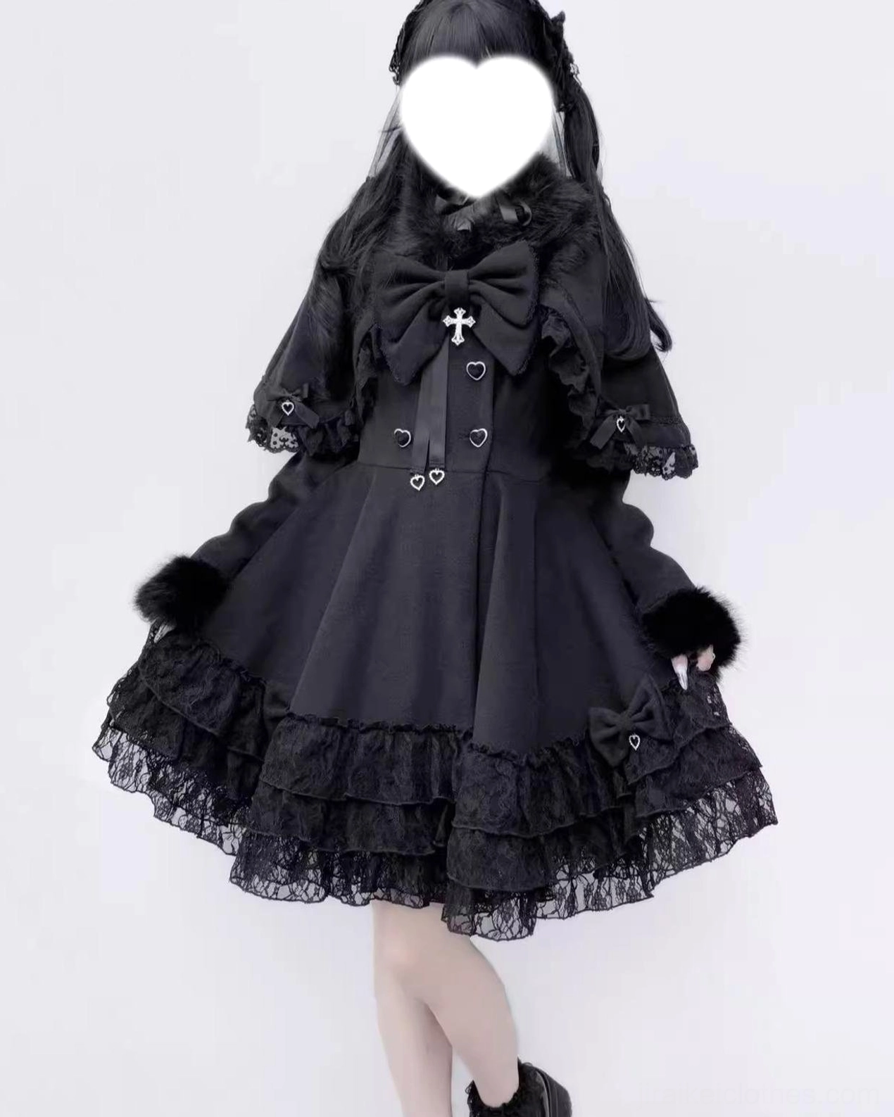 Right side front view of black Jirai Kei coat featuring double layered lace skirt hem, heart fasteners, and cross decorated collar bow