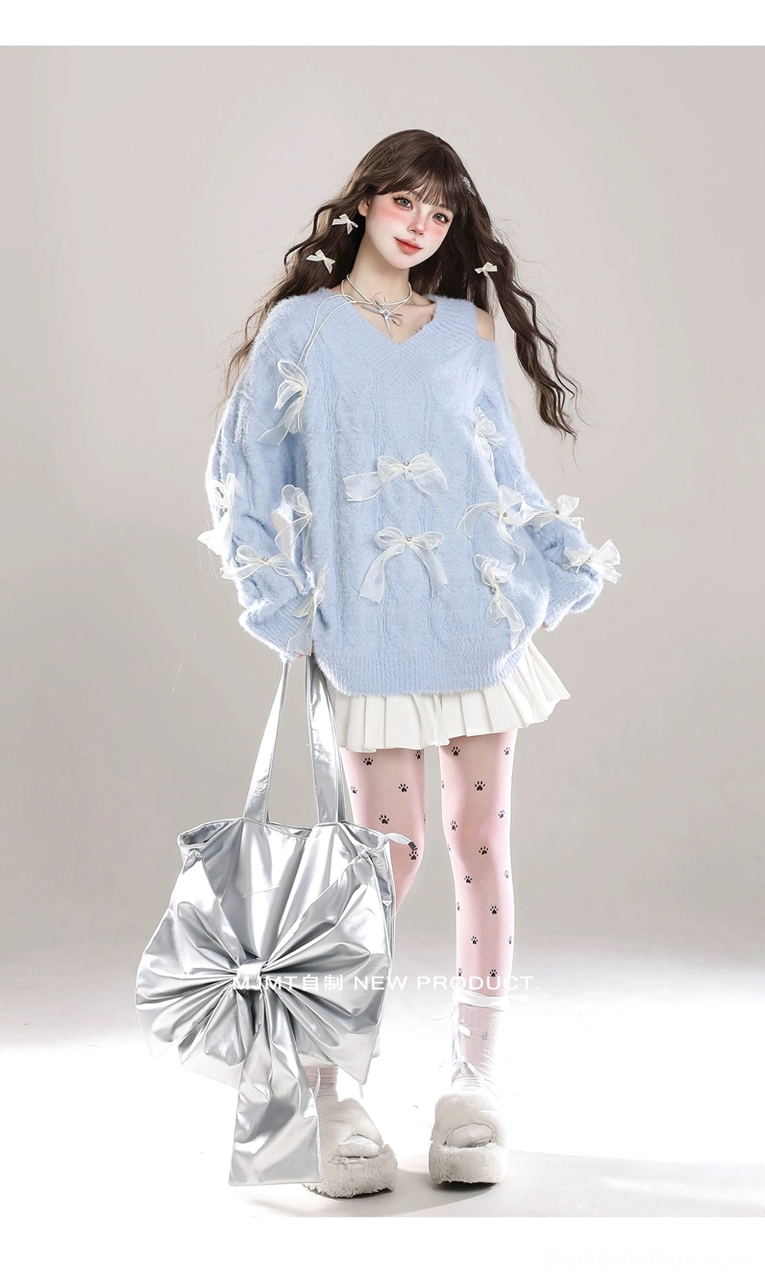 Jirai Kei cold-shoulder bow sweater fabric close-up showcasing fuzzy twisted knit construction, white ribbon bow details, and V-neck cut design elements