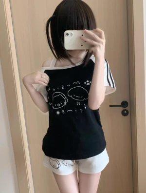 Black Jirai Kei cold-shoulder cartoon print t-shirt with white shorts and white sleeve trims, mirror selfie styling