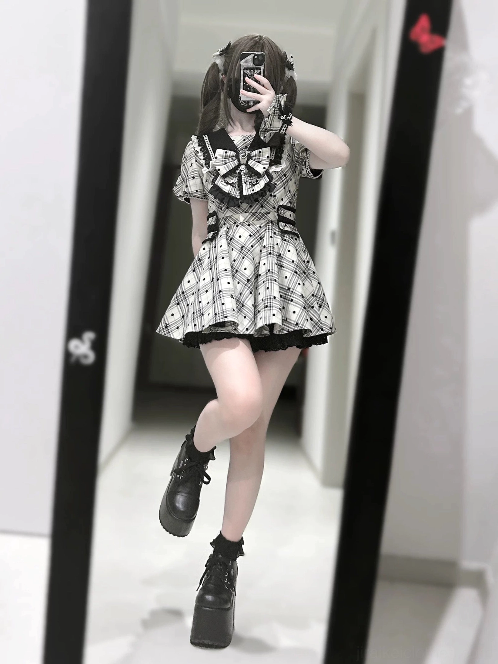 Model wearing complete Jirai Kei plaid polka dot dress set with wrist cuffs, side clips, and safety shorts styled with platform shoes