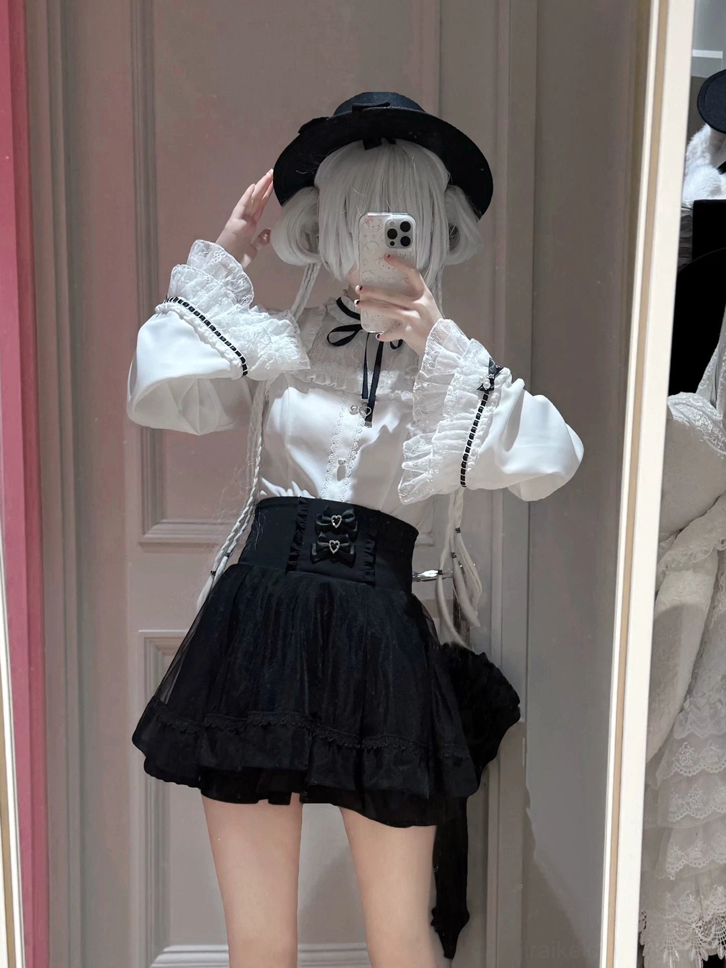 Full outfit styling of jirai kei two-piece set worn with black bowler hat, shoulder bag, and lace-trimmed socks, side profile mirror selfie