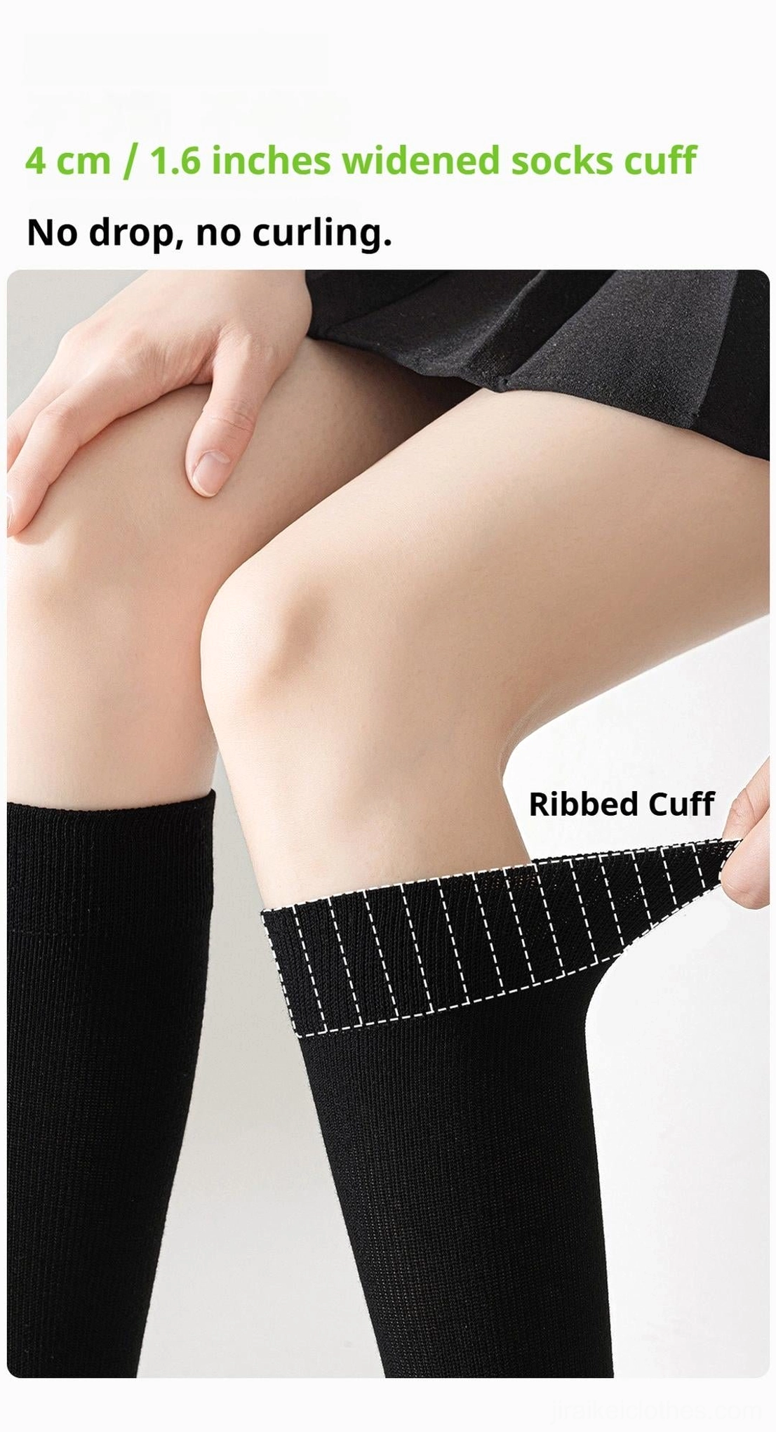 Close-up side leg view of ribbed cuff compression socks with 4cm widened cuff design preventing slipping and curling worn with black pleated skirt