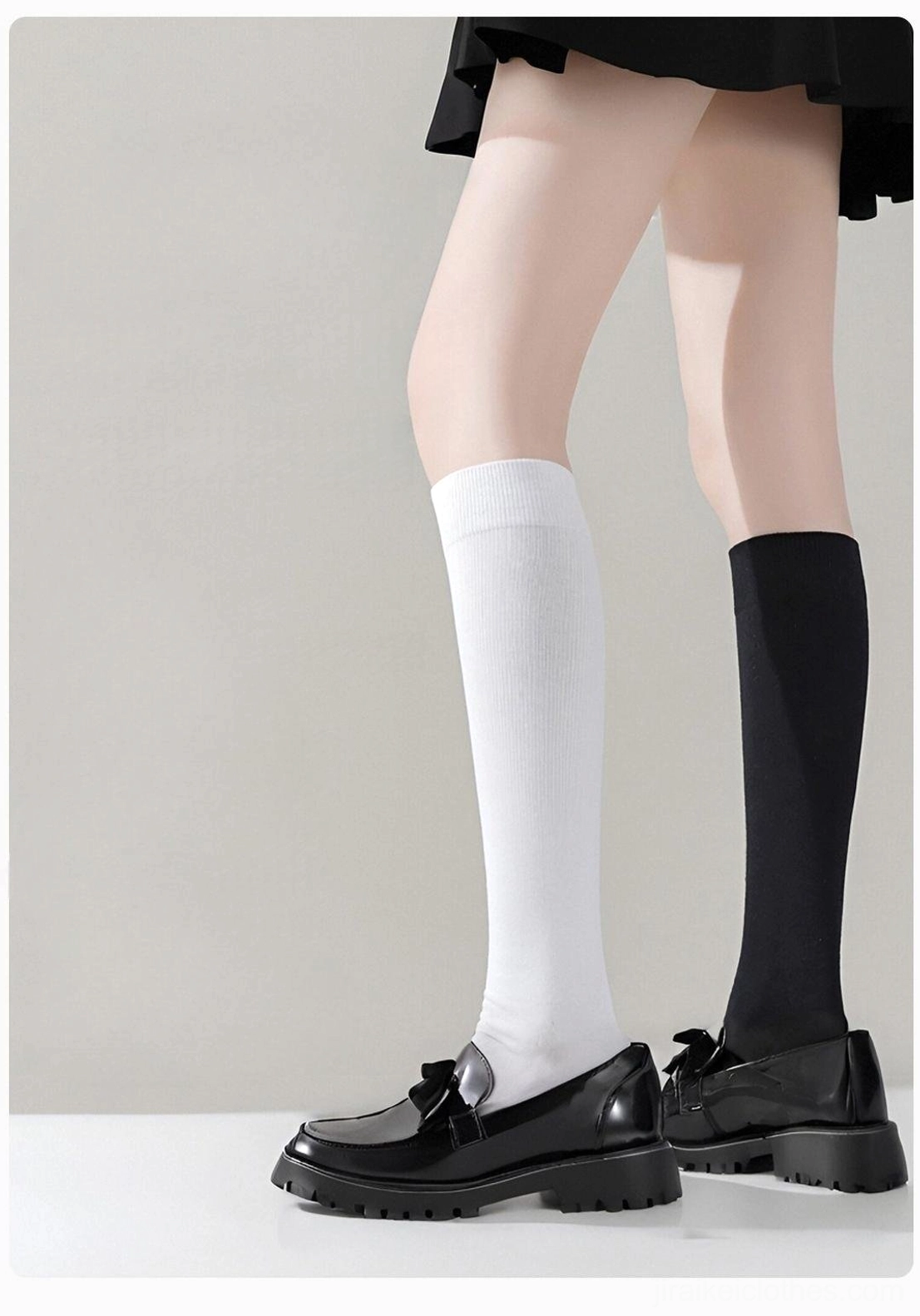 Knee-high compression socks side leg profile view showcasing black and white color options worn with leather loafers and pleated skirt for authentic Jirai Kei styling