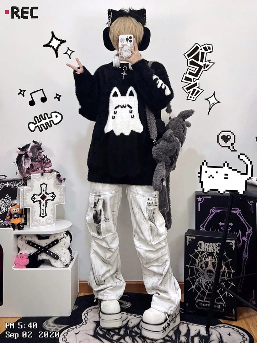 Ghost cat print chest embroidery detail of Jirai Kei couple sweater showing cute kawaii design centered on black fabric