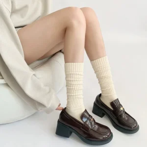 Jirai Kei mid-calf ribbed cotton socks in cream beige paired with block-heel loafers showcasing minimalist Y2K school style aesthetic
