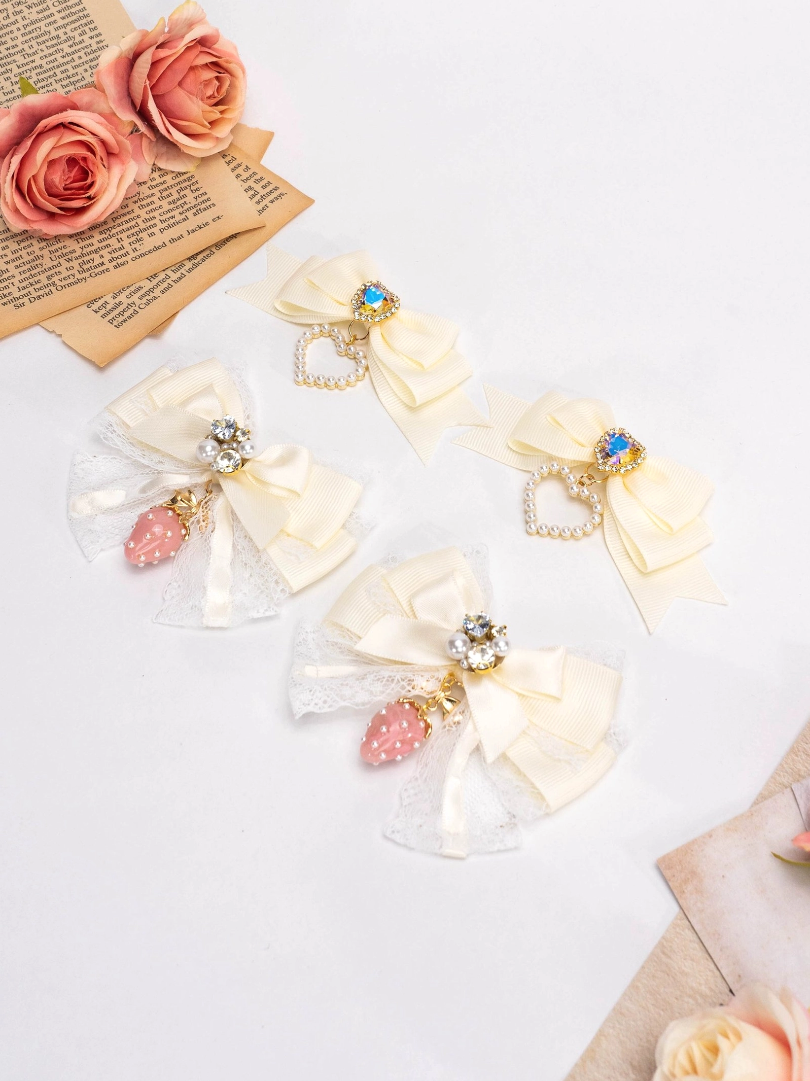 Mixed cream Jirai Kei lolita bow hair clips with lace strawberry charm and rhinestone heart accents collection