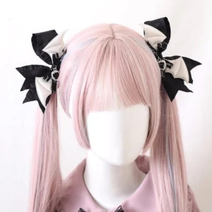 black and white demon wing satin bow hair clip with rhinestone detail jirai kei aesthetic twin tail hairstyle