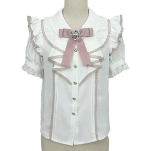 Jirai Kei doll collar lace blouse with white and pink color scheme, featuring detachable pink bow brooch and ruffled puff sleeves with beige lace cuffs, displayed on dress form