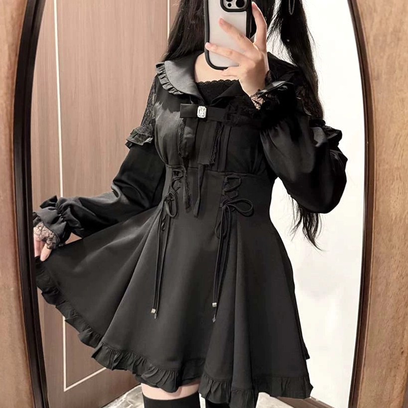 Jirai Kei dress front skirt-lifting mirror view displaying flared A-line skirt and lace cuffs detail