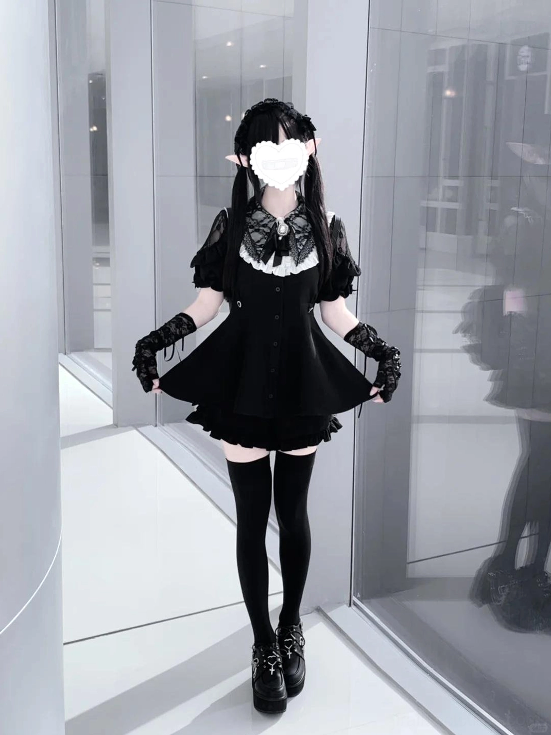 Jirai Kei dress set with fingerless gloves and platform block heels worn in glass corridor, showcasing lace collar details