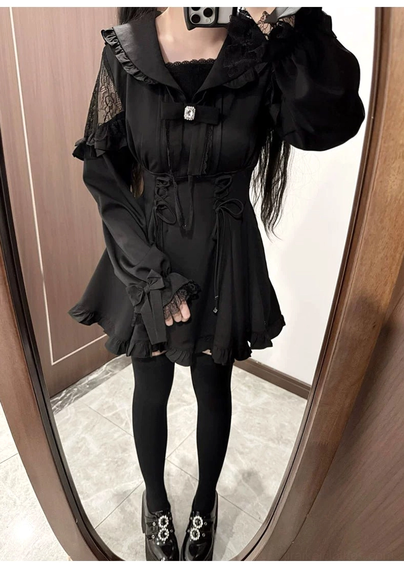 Side view of black Jirai Kei dress showcasing lantern sleeves lace details and ruffled skirt hem