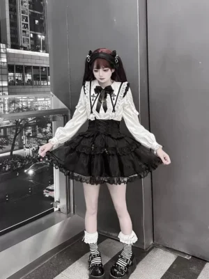 Gothic Lolita two-piece outfit full body three-quarter view black tiered ruffled skirt striped socks platform shoes night city background