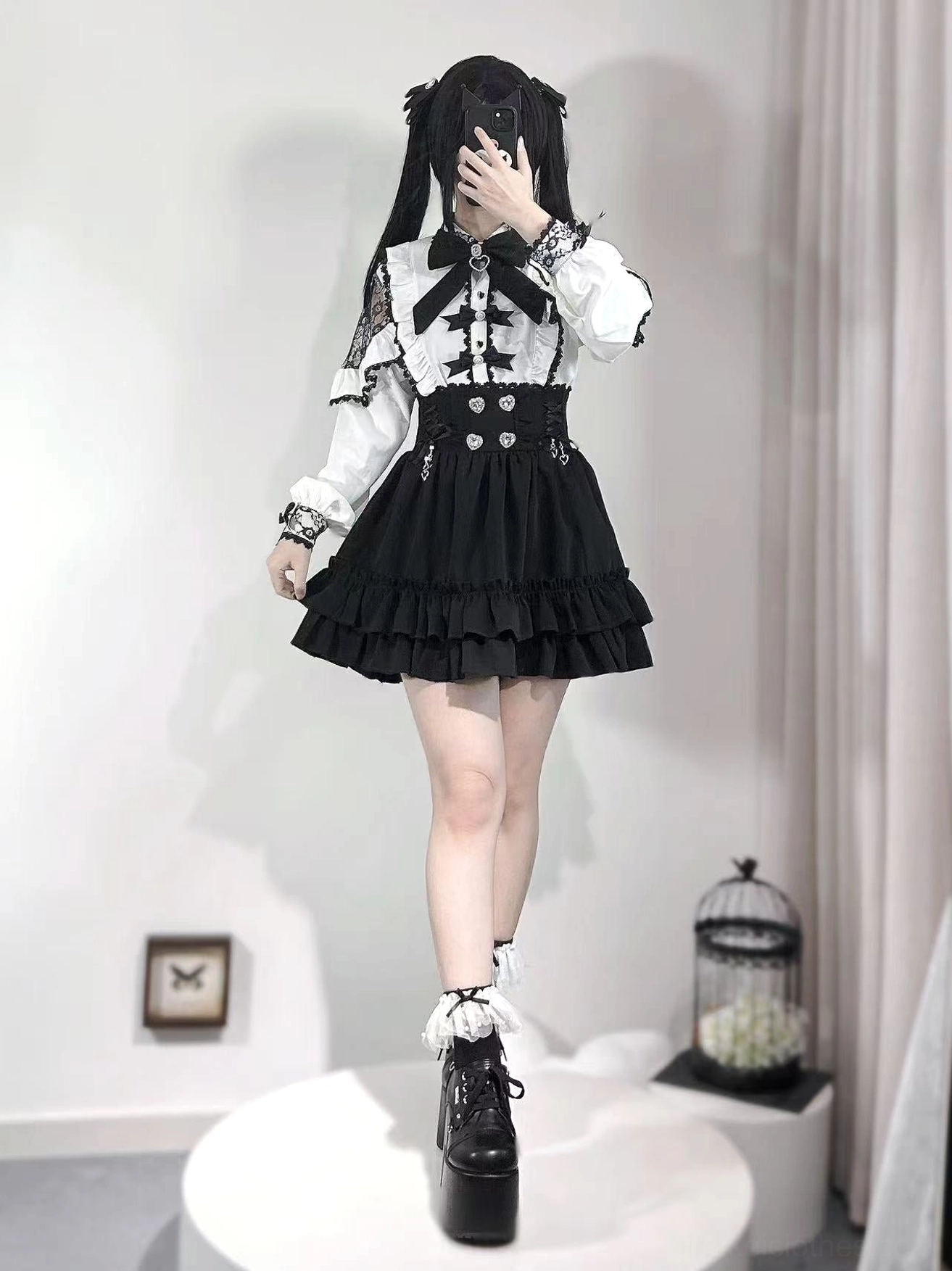 Jirai Kei front full-body coordinate with white lace-accented off-shoulder blouse, layered ruffled skirt, visible platform heel, and frilly sock cuffs detail