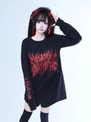 Jirai Kei oversized goth long-sleeve tee black and red brutal typography front view worn by model with twin tails and red hair accessories