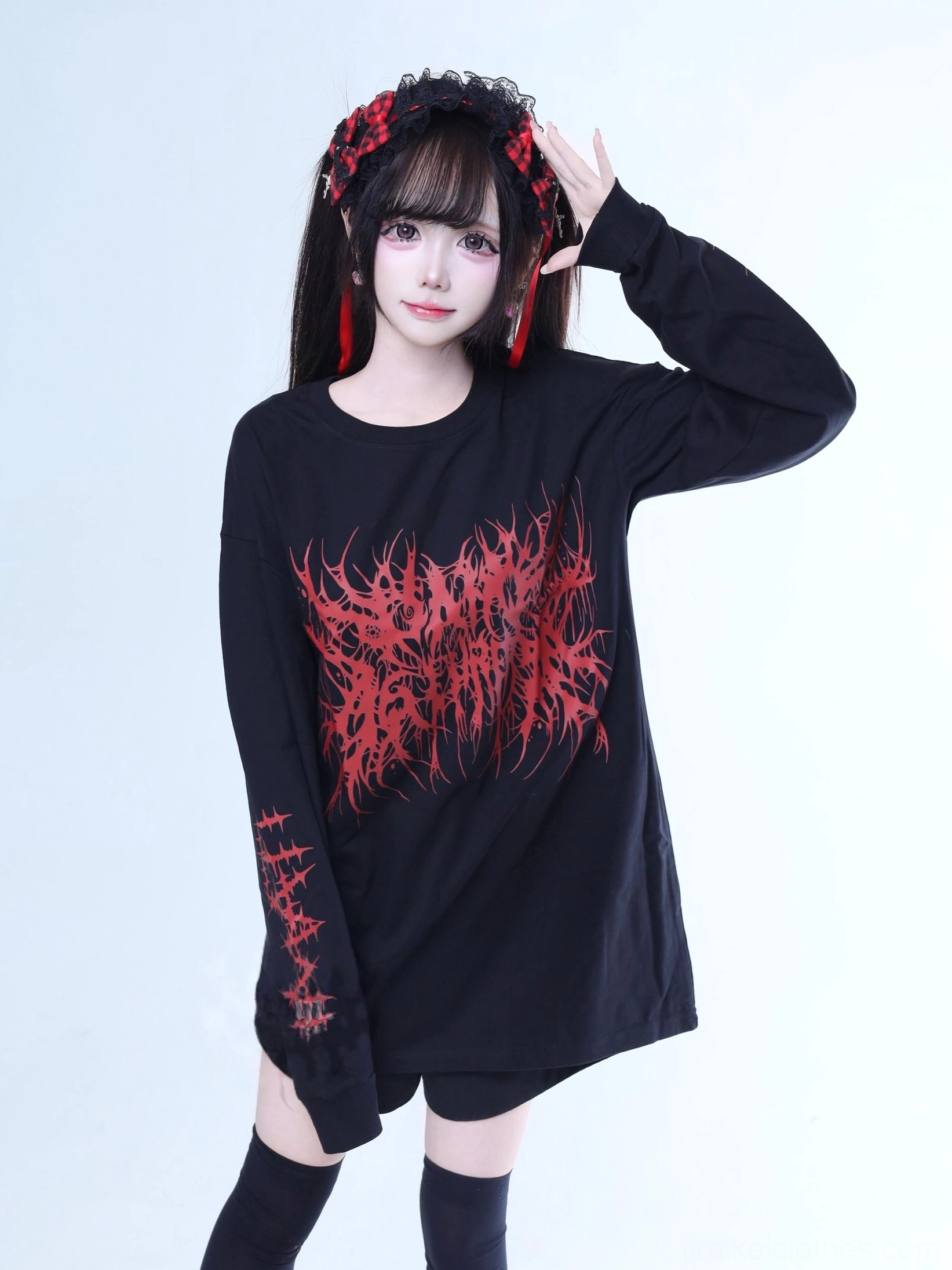 Jirai Kei oversized goth long-sleeve tee black and red brutal typography front view worn by model with twin tails and red hair accessories