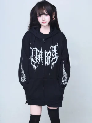 Black oversized jirai kei gothic hooded zip-up coat with white metal-inspired chest and sleeve prints front view on female model