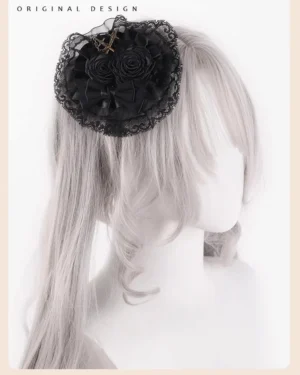 Black Gothic Lolita hair clip with lace rose and cross ornament decoration displayed on right side of twin tail wig dummy model