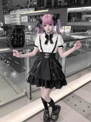 gothic jirai kei two-piece outfit full body front view with ruffled suspender skirt and detachable bow tie blouse