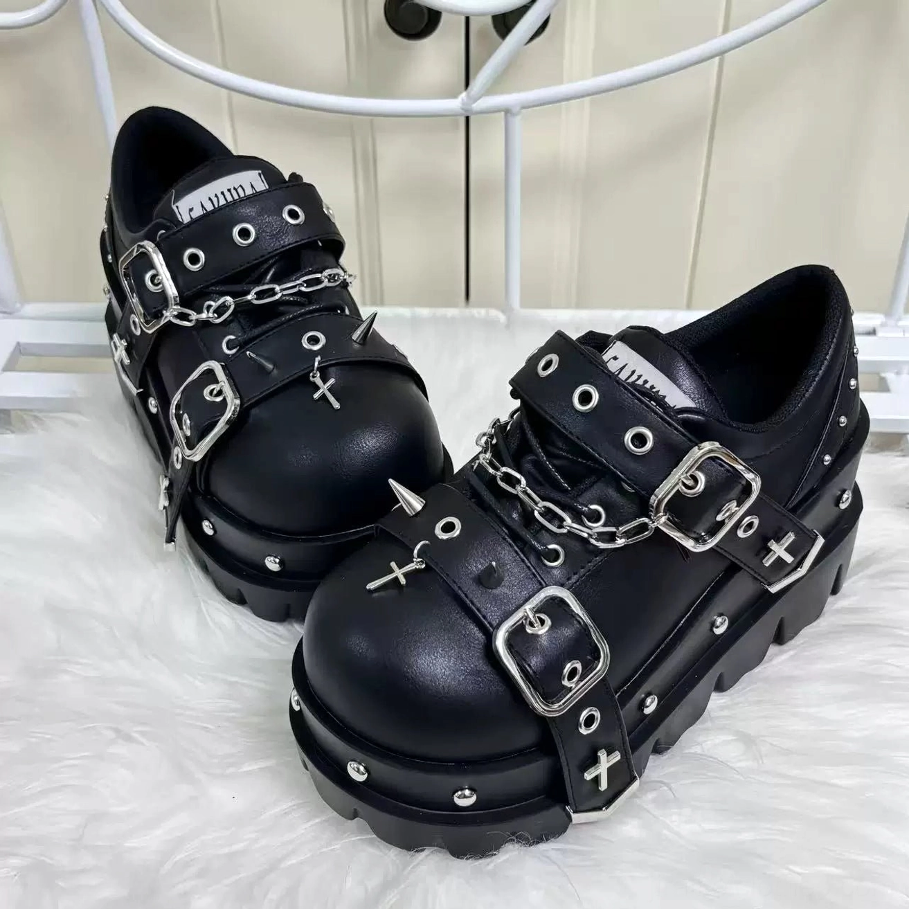 jirai kei gothic platform shoes front flat lay view white furry background silver buckles chains spike studs platform