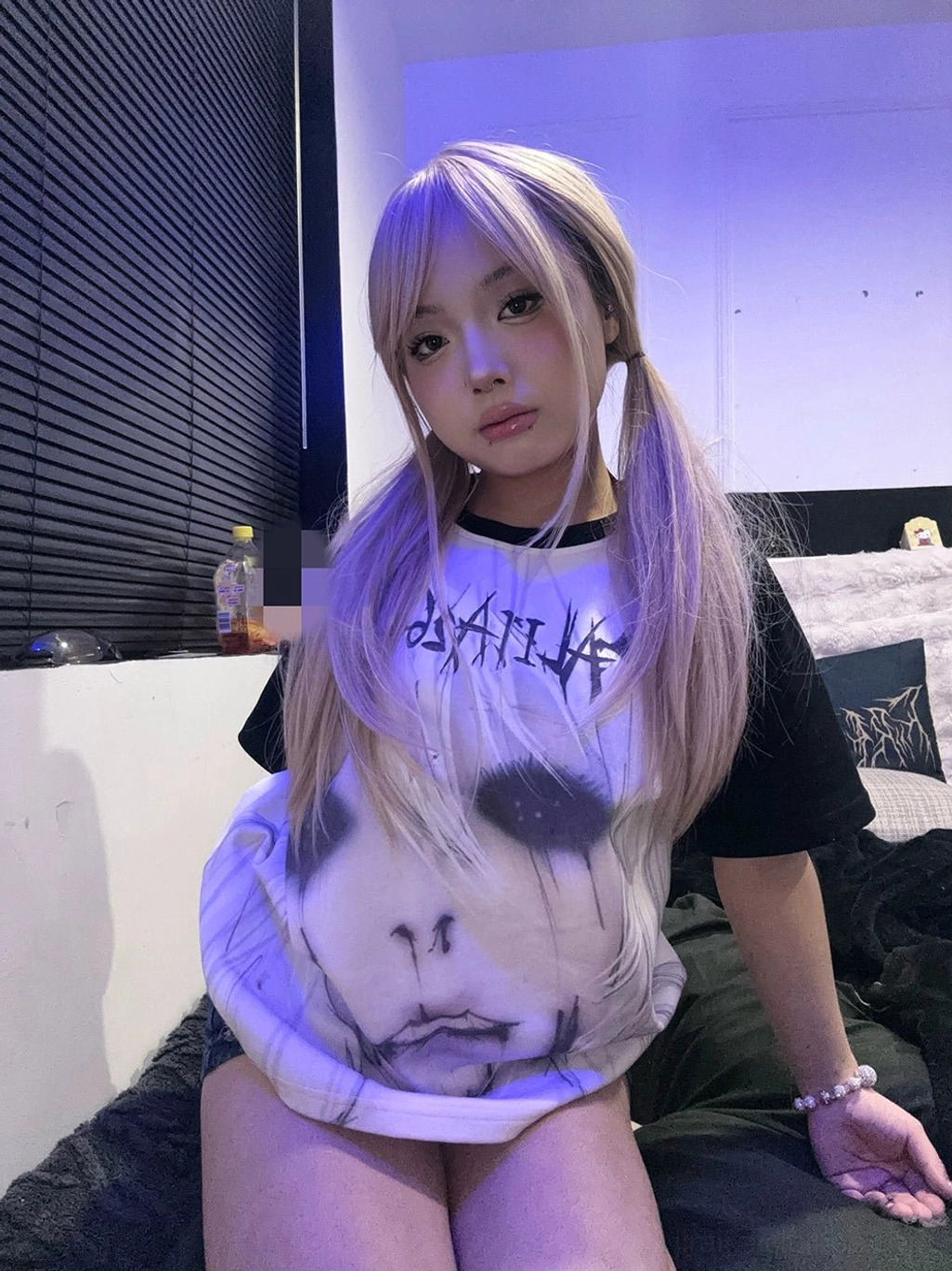 Jirai Kei gothic subculture raglan T-shirt with anime face graphic print and black short sleeves on loose fit tee