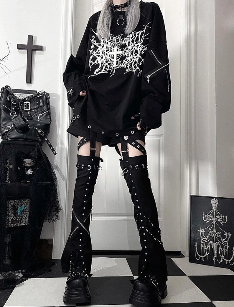 Back view detail of jirai kei oversized gothic long-sleeve t-shirt showing crew neck construction, sleeve zipper details, and overall garment back design perspective