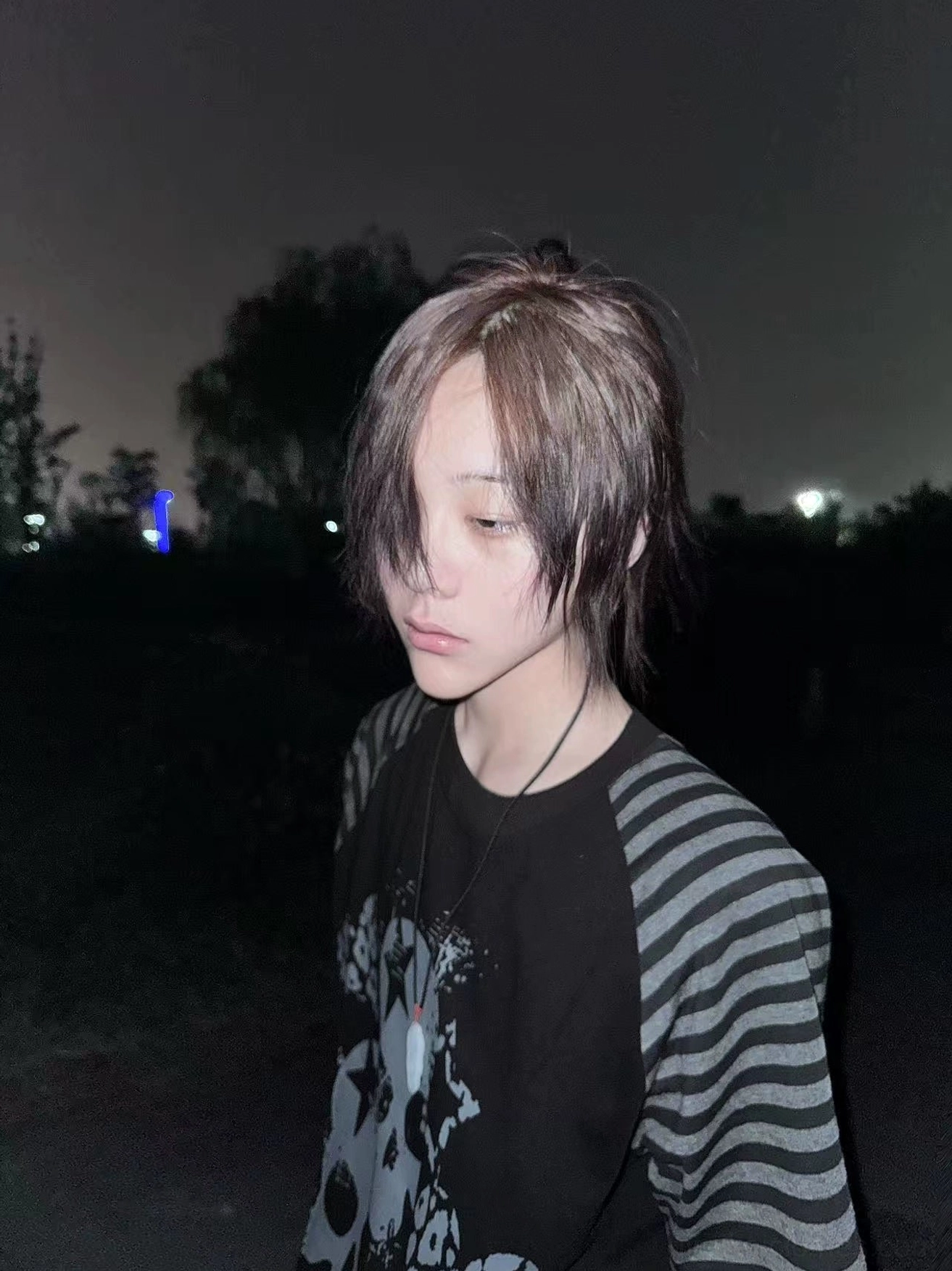 Side front close-up jirai kei gothic skull raglan t-shirt partial print view with pendant necklace