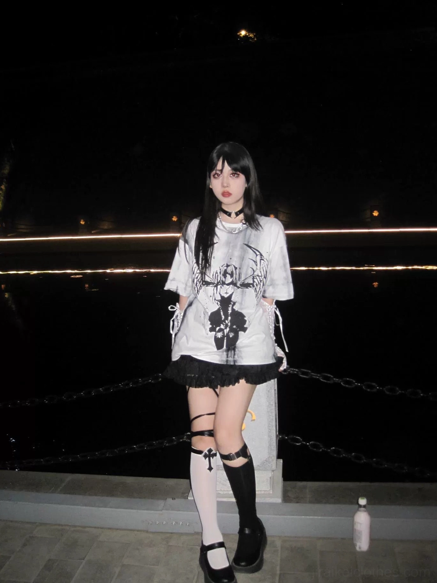Side view of unisex loose-fit tie-dye gothic t-shirt with celestial angel wings print, dark graphic design oversized silhouette