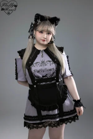 Gothic witch collar Jirai Kei cotton T-shirt dress with pointed black collar and off-shoulder sleeves, worn by blonde model with cat ear accessories in studio setting