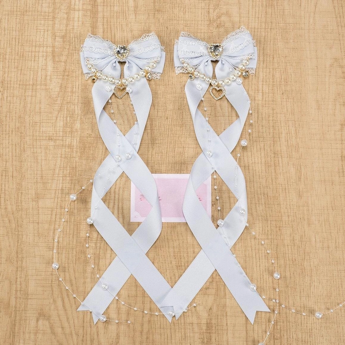 Jirai Kei gray-blue bow hair clips with ribbon knit construction pearl chain embellishment and decorative rhinestone
