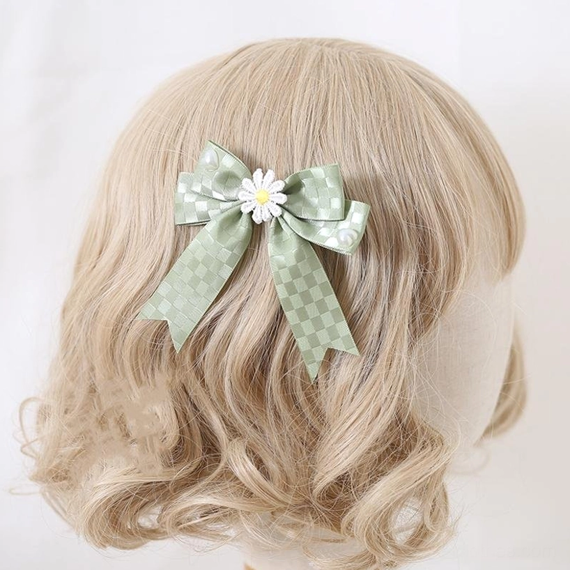 Green checkered ribbon Jirai Kei bow hair clip with delicate daisy flower embellishment center, photographed on mannequin blonde wig back view—vintage alternative hair accessory