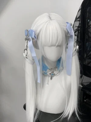 Jirai Kei twin ponytail hair clips featuring dual cross pendants and black heart-shaped rhinestone centerpiece on mannequin wearing straight bangs - direct front view
