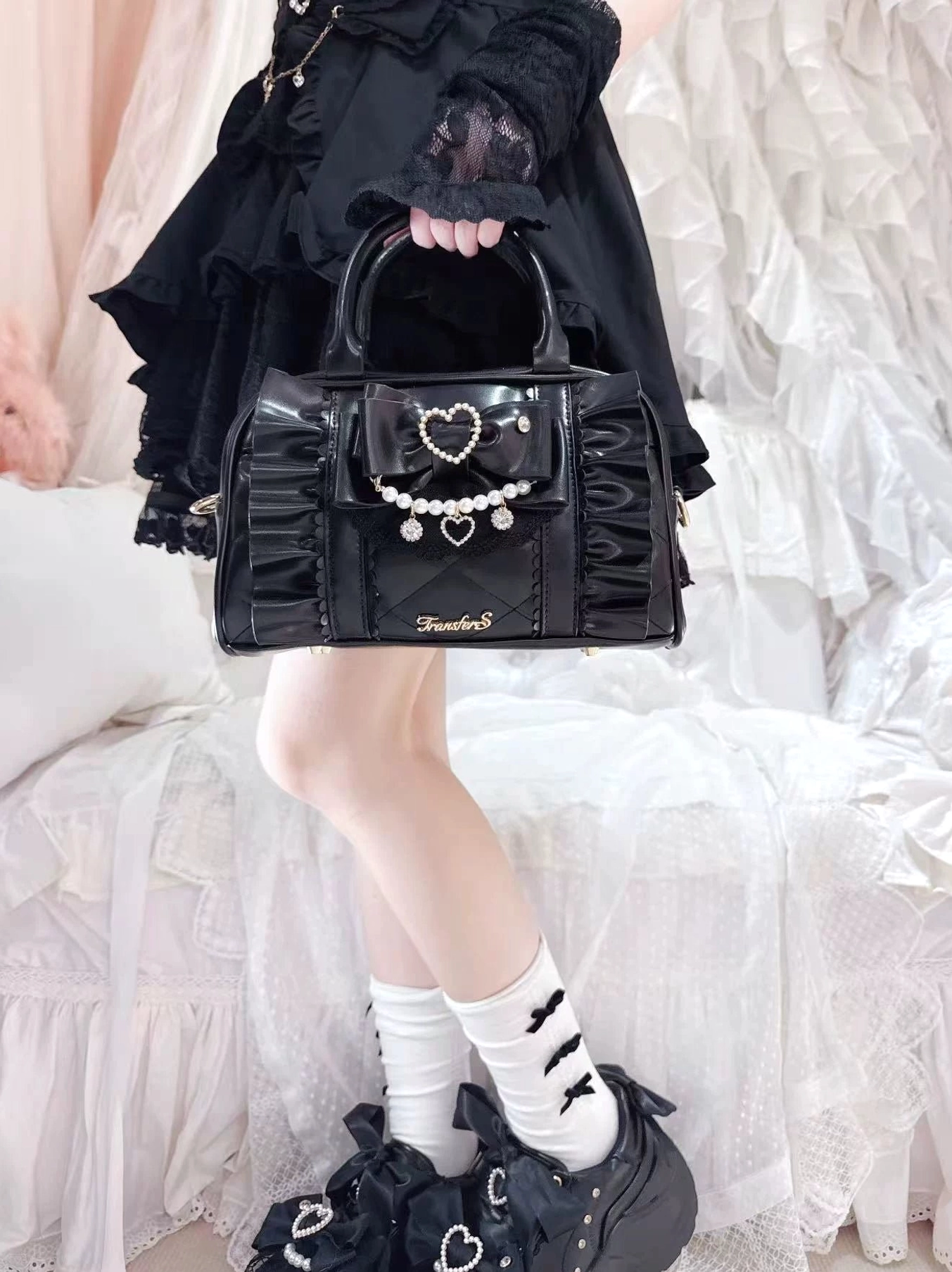 Jirai Kei handbag bow charm detail photography highlighting the decorative pearl ornament and fabric craftsmanship