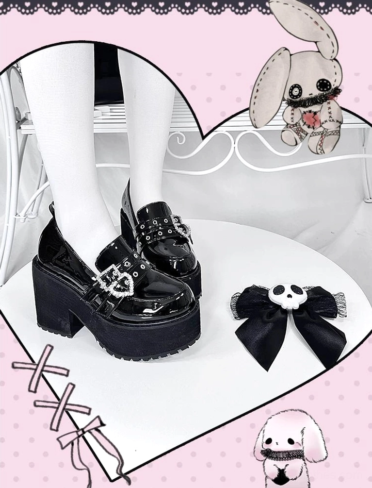 Close-up detail of heart-shaped rhinestone buckle straps on jirai kei punk platform loafers showing crystalline embellishments and fastening quality