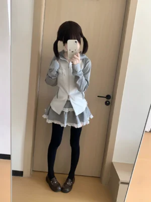 Gray-white color-block Jirai Kei hoodie jacket with cute puppy ears displayed on model in mirror, showing slim fit silhouette