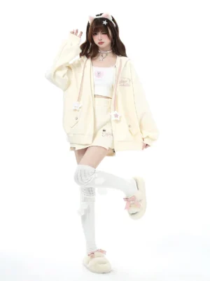 Jirai Kei cream-colored hoodie zip-up jacket with star-adorned drawstring and matching mini skirt set, full-body front view on model with studio background