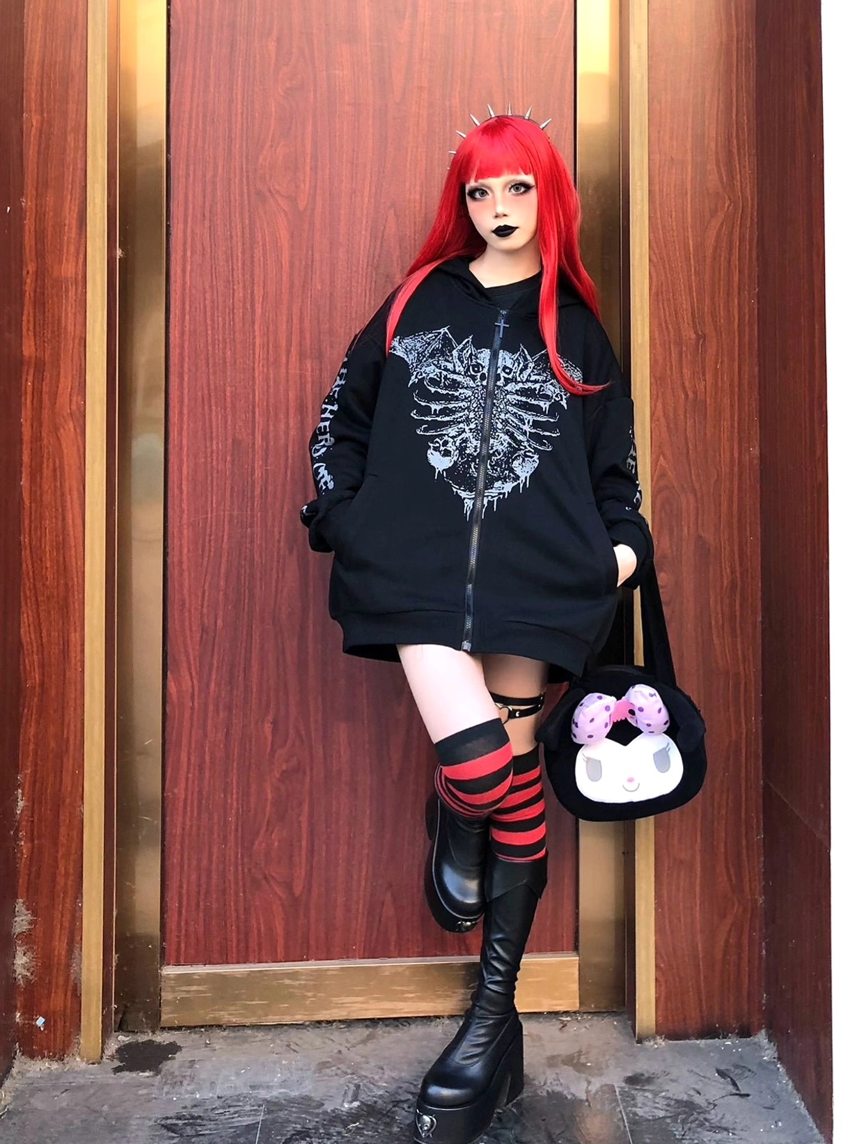 Jirai Kei hoodie sleeves close-up showing intricate cryptic text prints and gothic typography, detail of punk graphic sleeve design and fabric texture