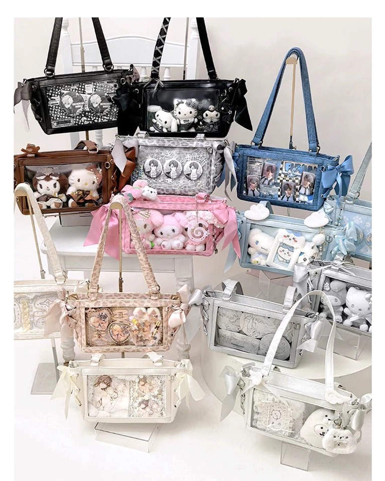 Wide showroom flat lay of assorted Jirai Kei ita bag collection featuring multiple colors, patterns and decorative styles